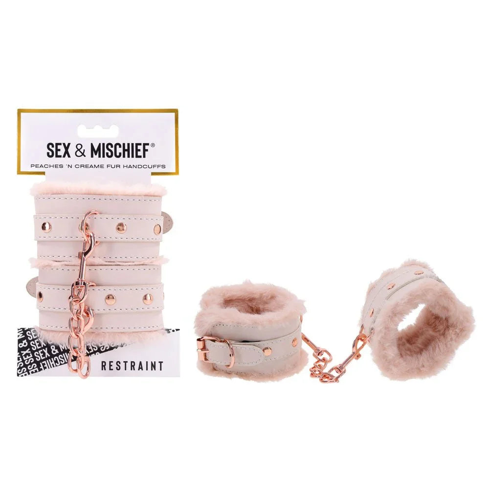 Sex & Mischief Peaches 'n Creame Fur Handcuffs on their card, cream cuffs with peach fur