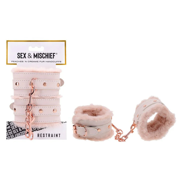 Sex & Mischief Peaches 'n Creame Fur Handcuffs on their card, cream cuffs with peach fur