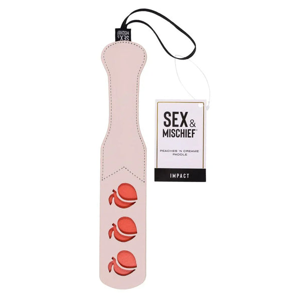 Sex & Mischief Peaches 'n Creame Impression Paddle hanging by its tag, three peach cut-outs