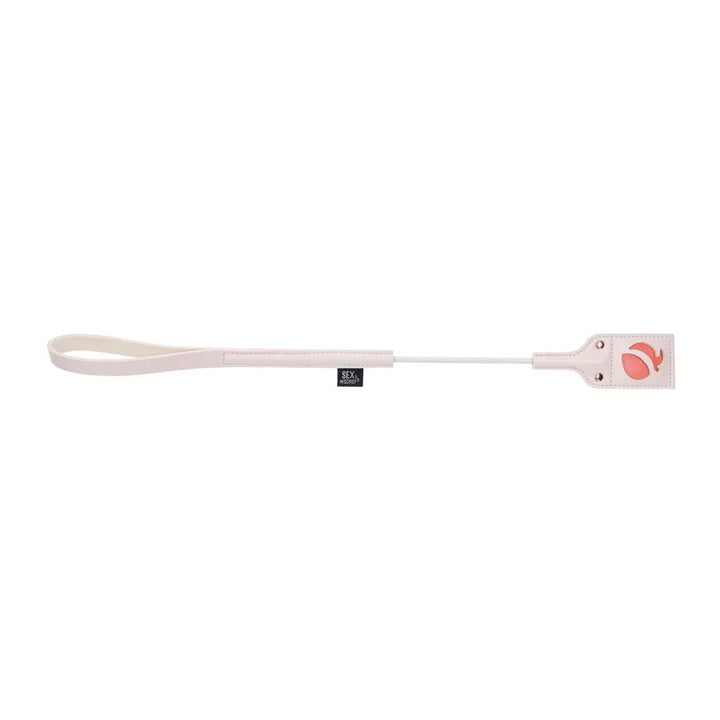 Peach Impressions Crop laid horizontally, motif tip at right and wrist loop at left