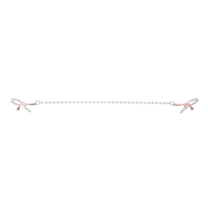 Pearl nipple clamps pulled apart with the pearl chain stretched straight