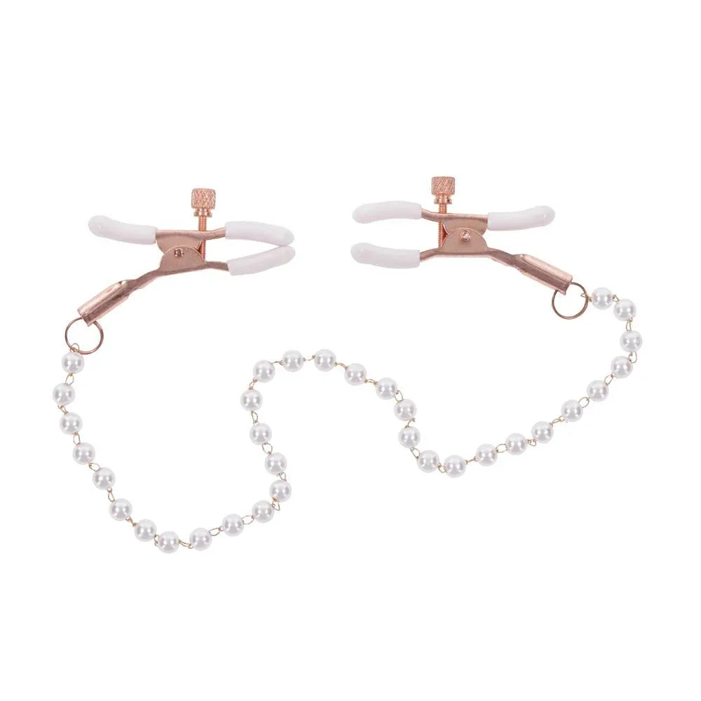 Pearl nipple clamps facing each other with the chain looping beneath