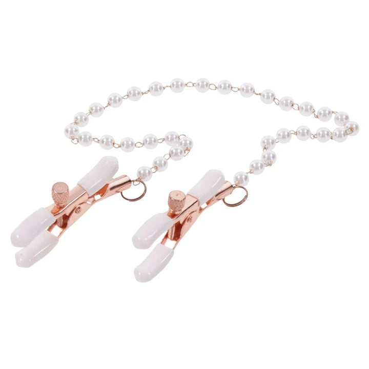 Pearl nipple clamps angled with the pearl chain looped above them