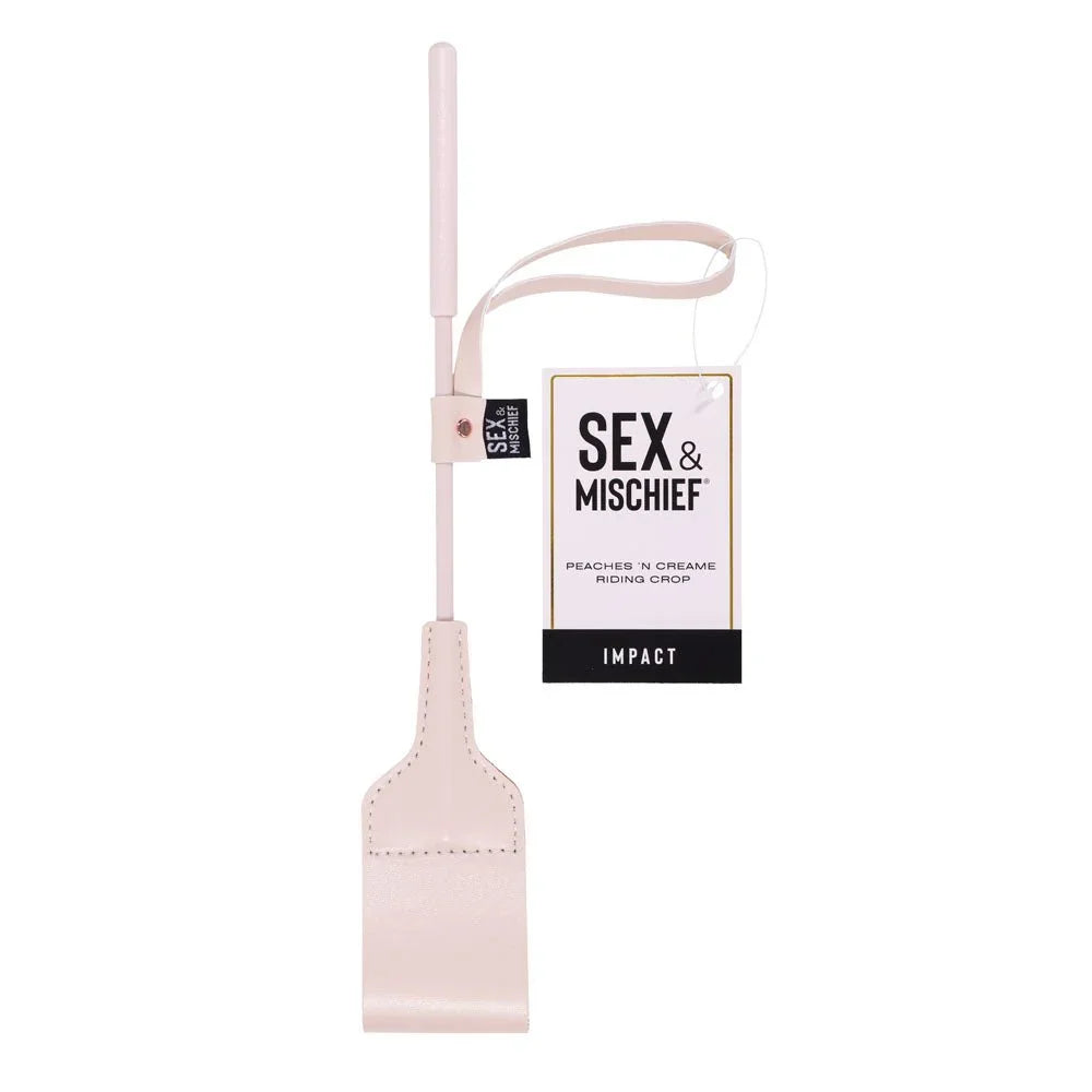 Sex & Mischief Peaches 'n Creame Riding Crop hanging by its retail tag