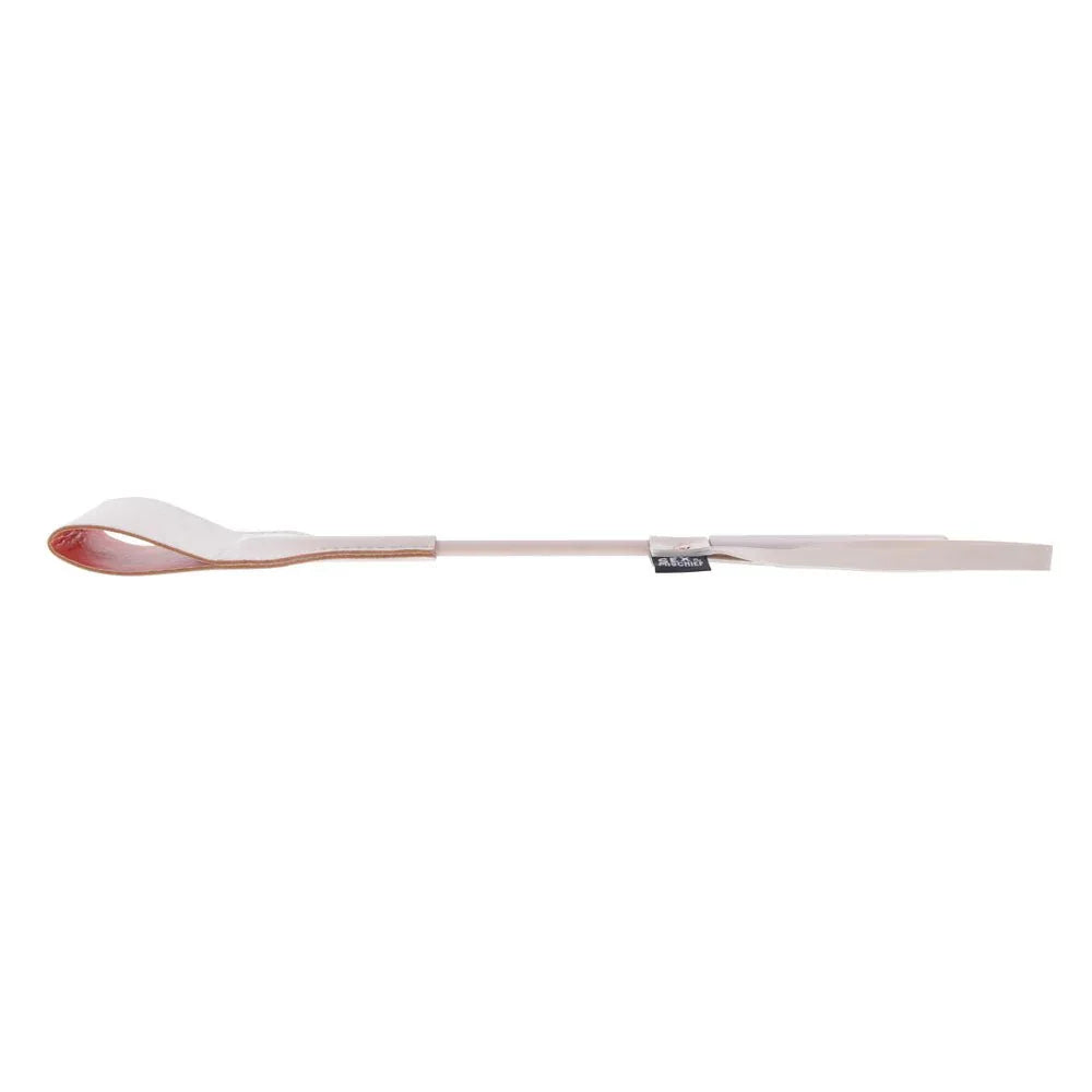 Peach riding crop with the tip curled over to show the coral inner face