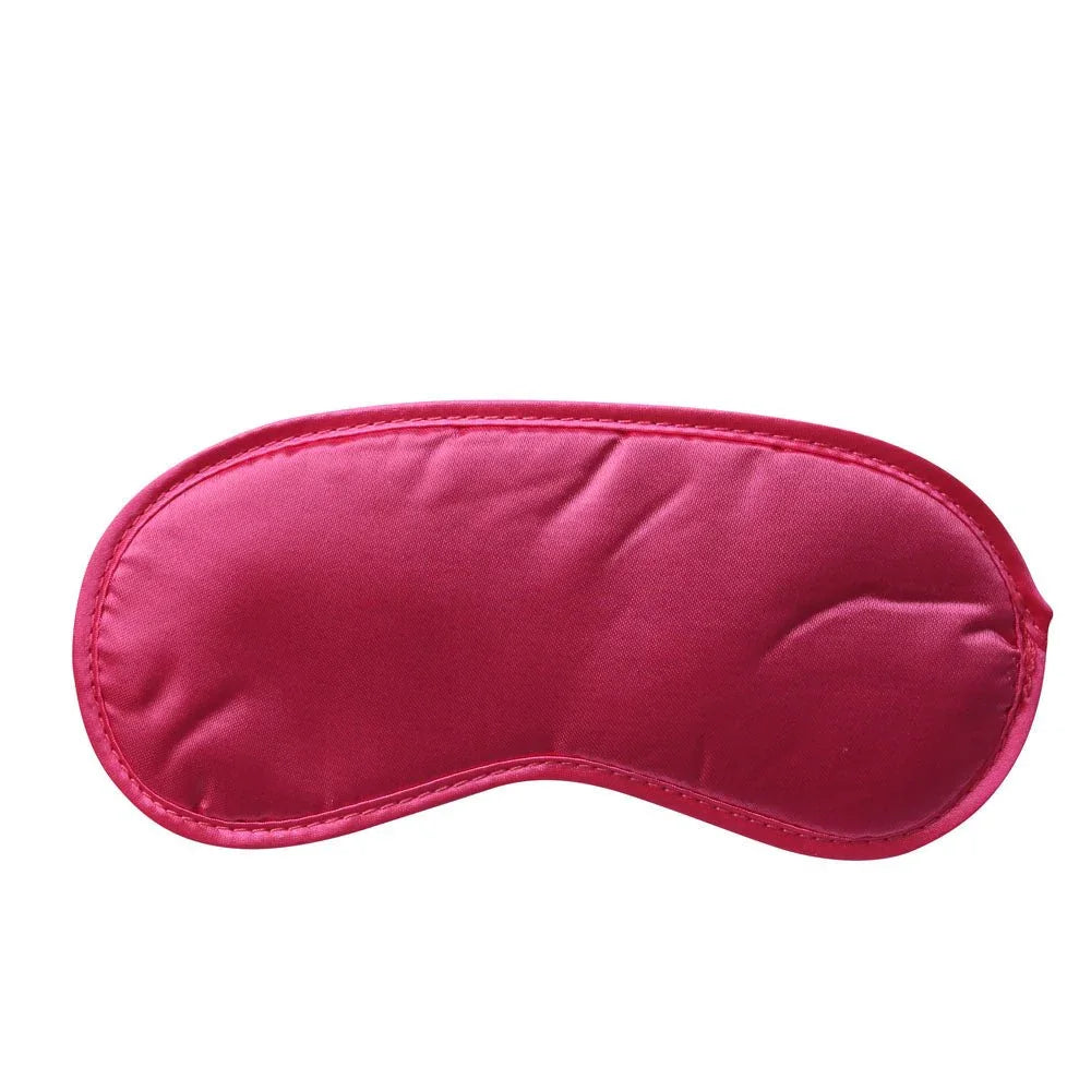 Hot pink satin blindfold laid flat on white