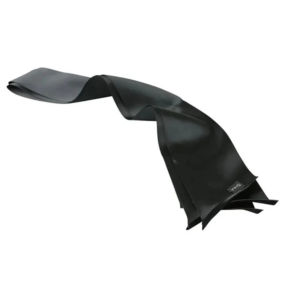 A black Silky Sash laid out in a long S curve