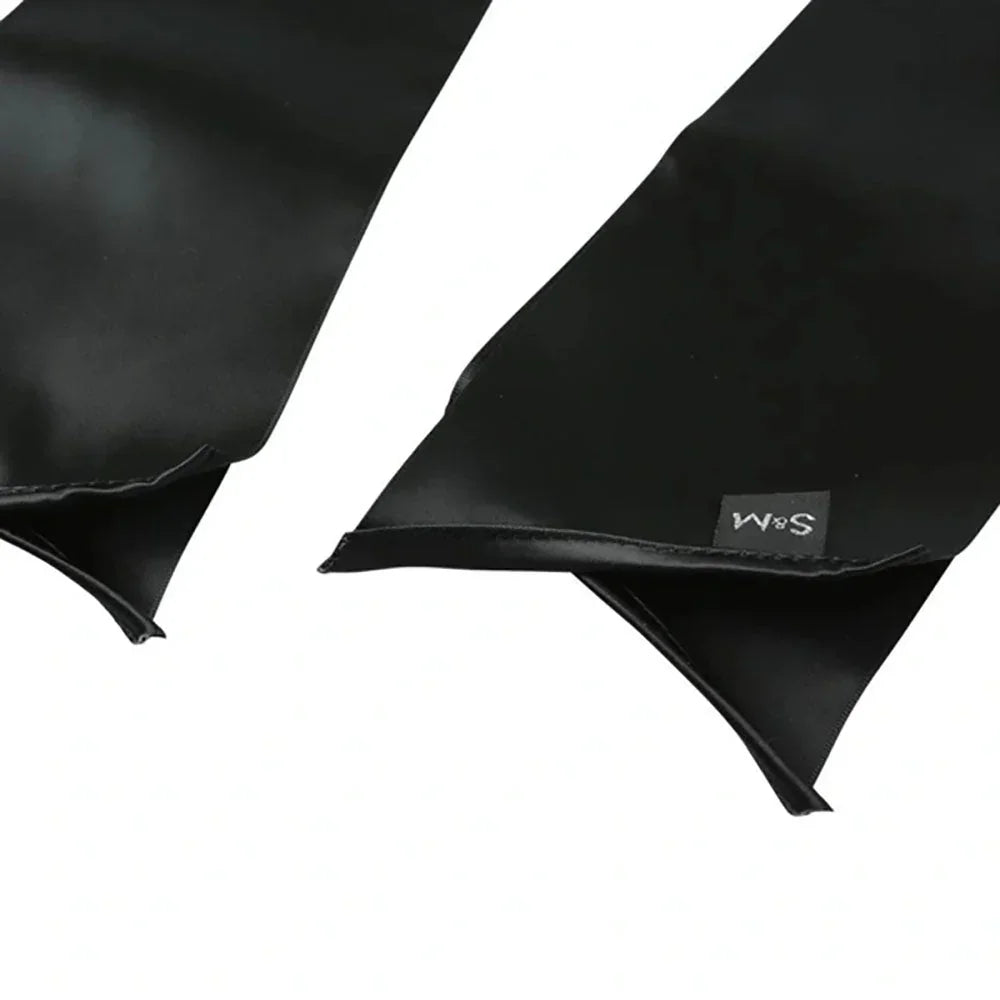 Close-up of the sash ends showing the pointed tips and the S&M tab