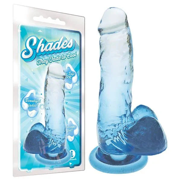 Shades jelly dong fading pale to deep blue on a suction base, beside its blister pack