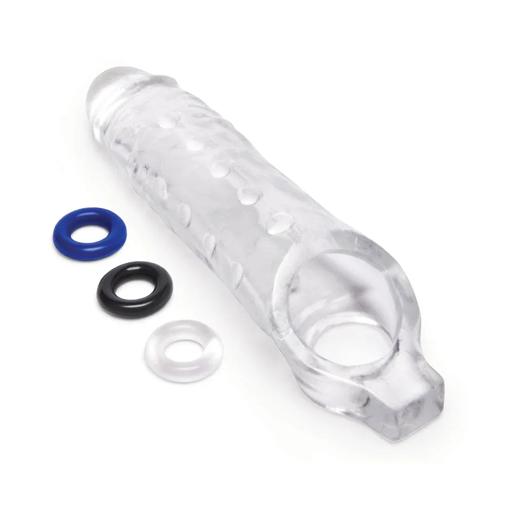Size Up 1 inch clear extender lying diagonally with its three stamina rings