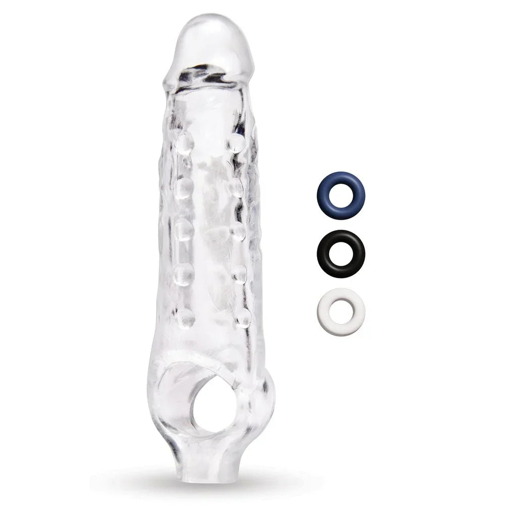 Size Up 1 inch clear extender upright beside blue, black and clear stamina rings