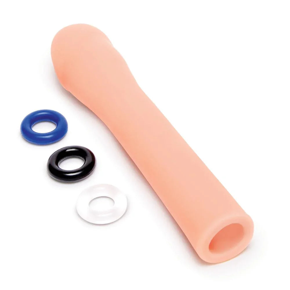 Size Up 3 inch extender lying diagonally, hollow open end towards the camera