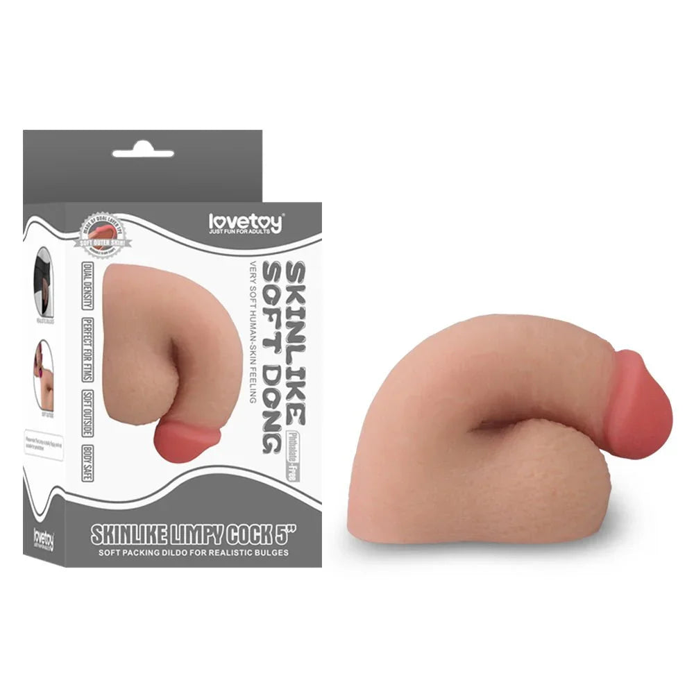 Lovetoy Skinlike Limpy Cock packer 5 inch in Flesh, soft flaccid dong beside its grey box