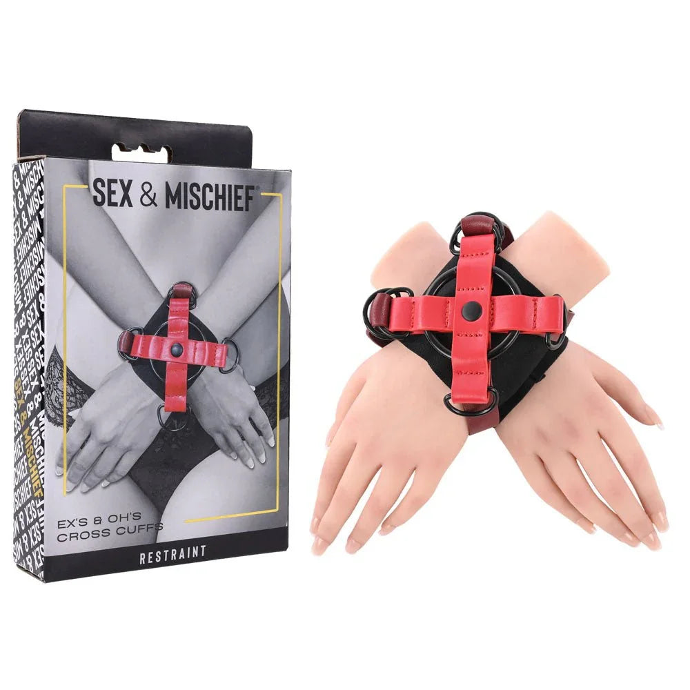 Sex & Mischief Ex's & Oh's Cross Cuffs box beside the red X cuff on mannequin hands