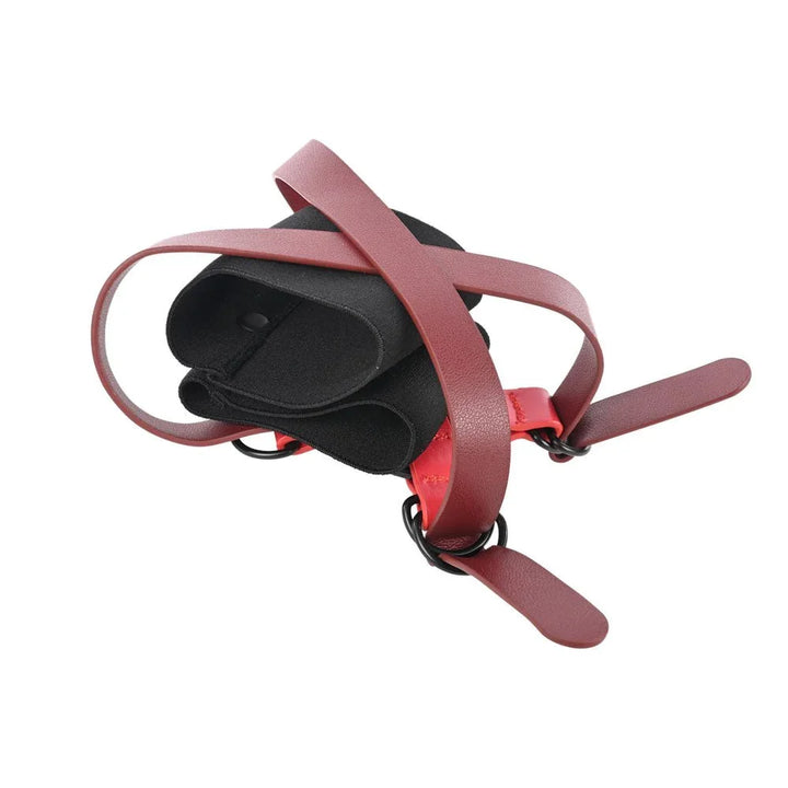 Cross Cuffs from the side with the burgundy tightening straps hanging free