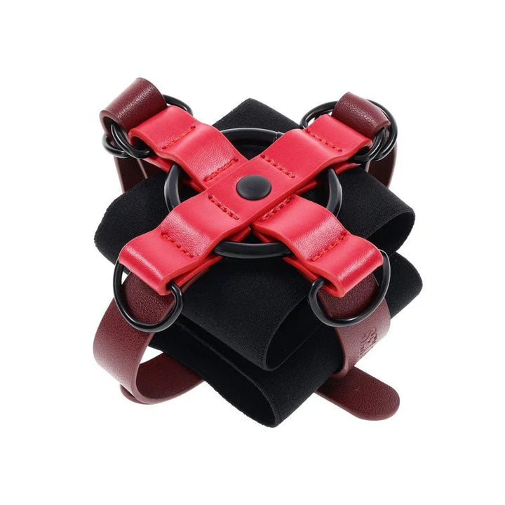 Ex's & Oh's Cross Cuffs alone, red X strap over the black spandex cuff
