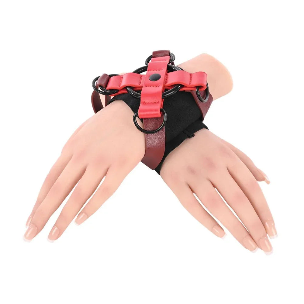 Ex's & Oh's Cross Cuffs on crossed mannequin wrists, angled view