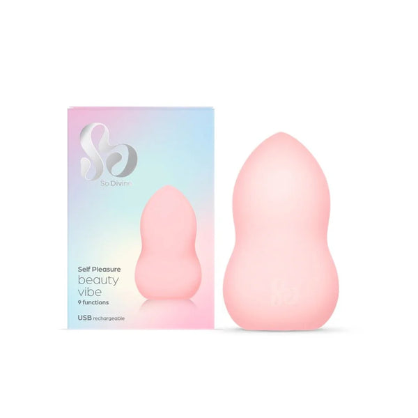 So Divine Beauty Vibe in blush pink beside its holographic box