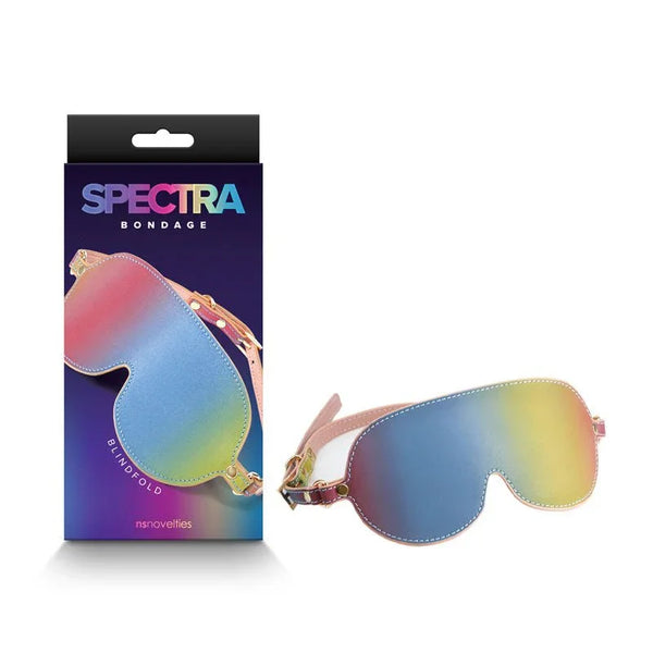 Spectra Bondage blindfold in rainbow gradient with gold hardware, beside its box