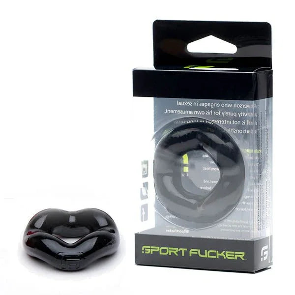 Sport Fucker Revolution Ring in Black, lip-shaped ring in front of its box