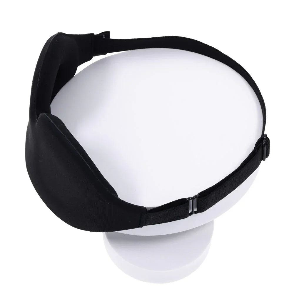 Blackout Blindfold curved to show its contoured shape and adjustable strap