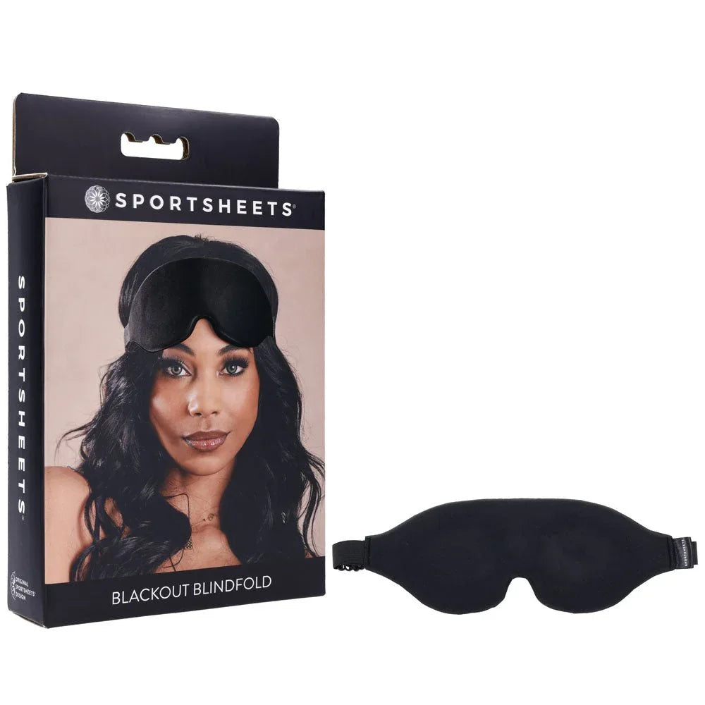 Sportsheets Blackout Blindfold box beside the black contoured eye mask