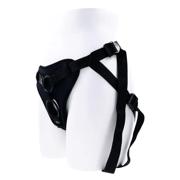 Dual Desires harness on a mannequin form, angled to show the thigh straps