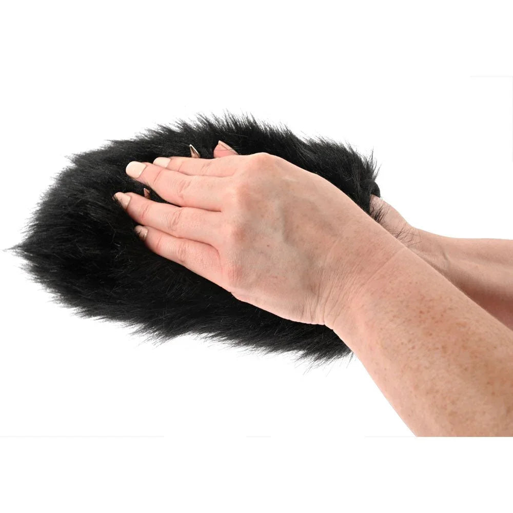 The sensory mitt worn on a hand, seen from the side