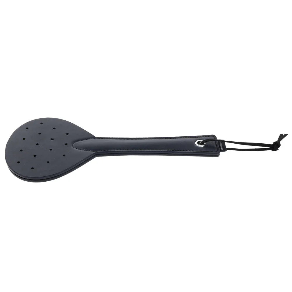 Swift Spanker laid flat with the elastic wrist cord at the right