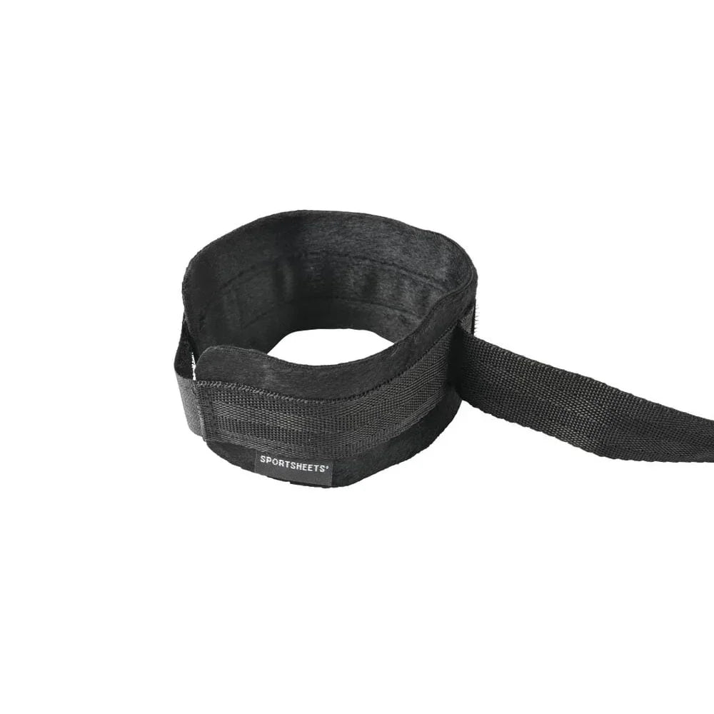 A single Velvet Noir soft cuff with its adjustable tether strap