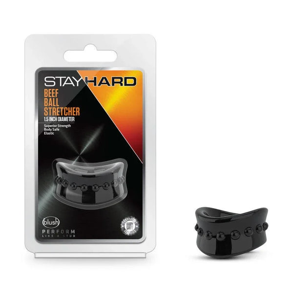 Stay Hard Beef Ball Stretcher in black, studded silicone ring beside its blister pack
