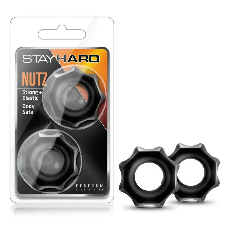 Stay Hard Nutz cock rings, two black cog-edged rings beside their blister pack