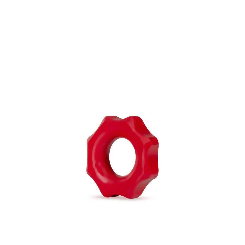 A single red Stay Hard Nutz cock ring on white, showing the notched silicone edge