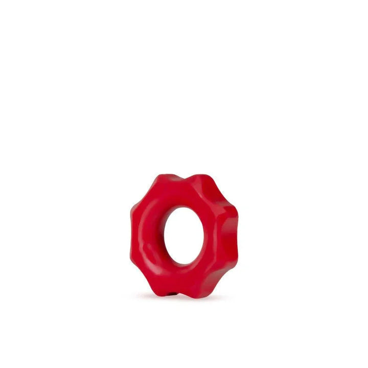 A single red Stay Hard Nutz cock ring on white, showing the notched silicone edge