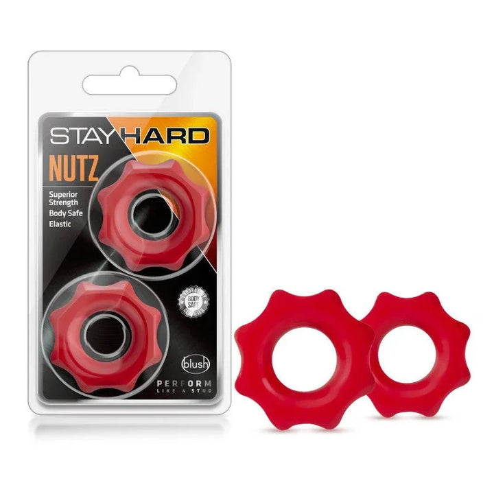 Stay Hard Nutz cock rings, two red cog-edged rings beside their blister pack