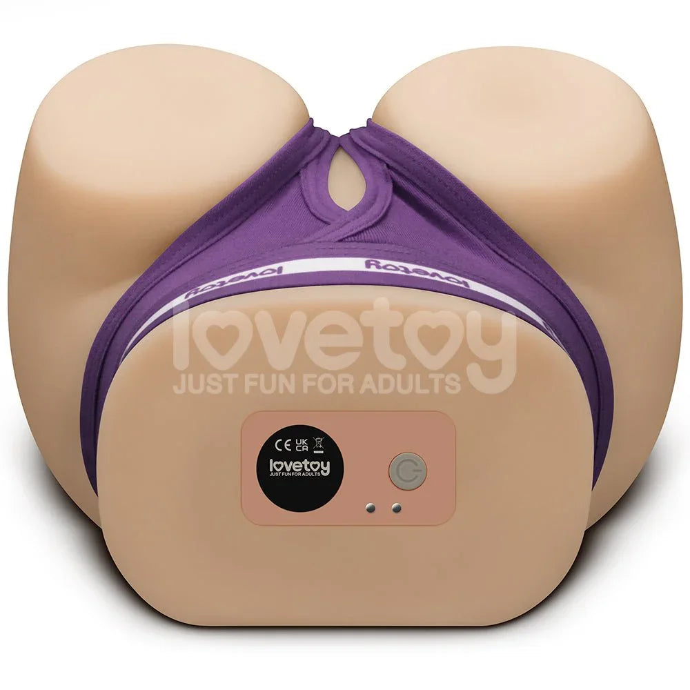 Base of the Streetgirls masturbator showing the control button and charging panel