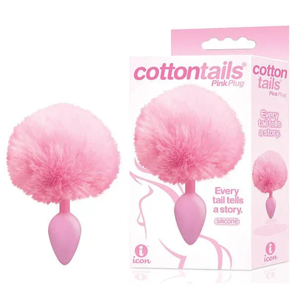 The 9's Cottontails smooth plug in Pink with a pink pom-pom tail, beside two retail boxes