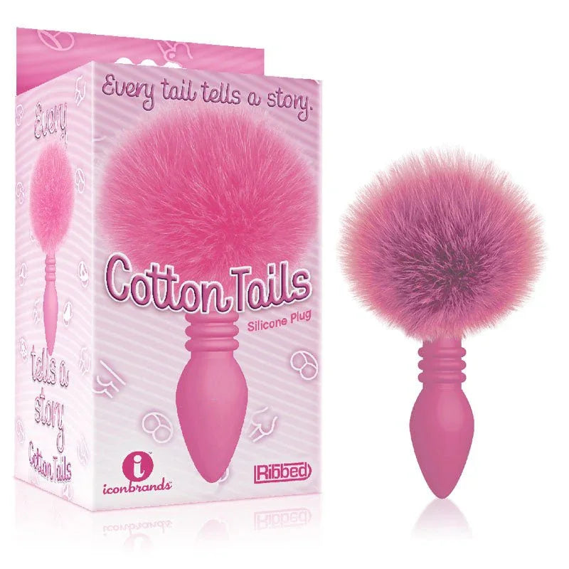 The 9's Cottontails ribbed plug in Pink with a pink pom-pom tail, beside its retail box