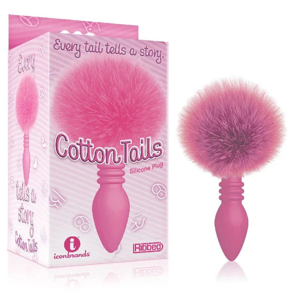 The 9's Cottontails ribbed plug in Pink with a pink pom-pom tail, beside its retail box