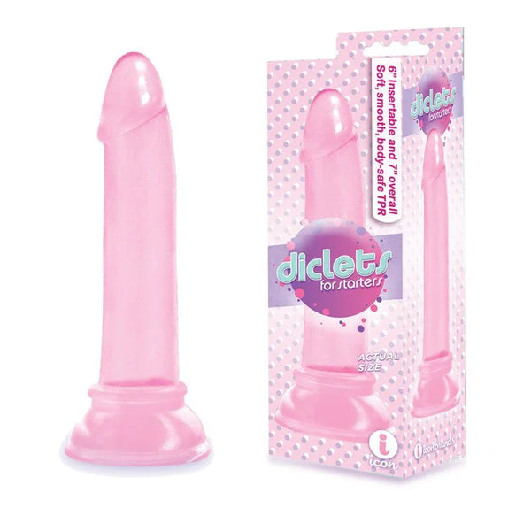 The 9's Diclets dong in Pink on a suction base, beside its retail box