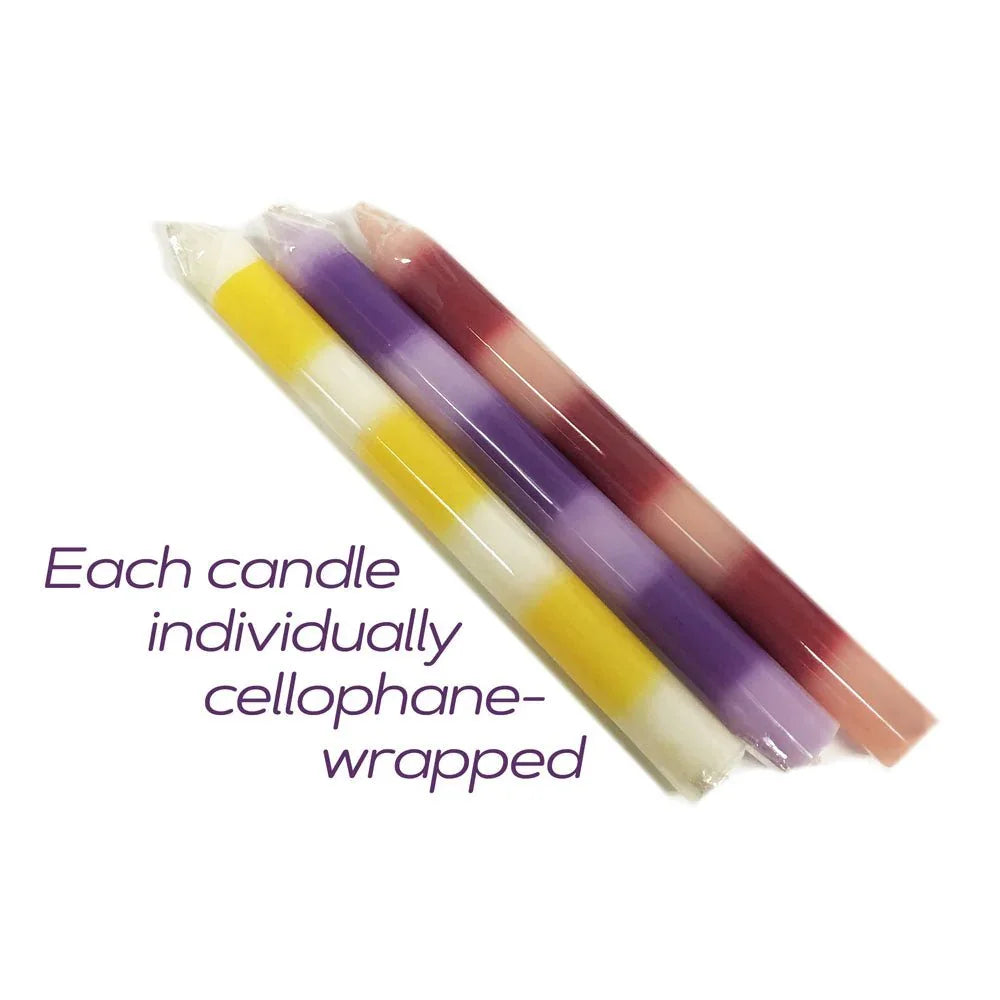 The three Pastellines candles lying cellophane-wrapped, captioned individually wrapped