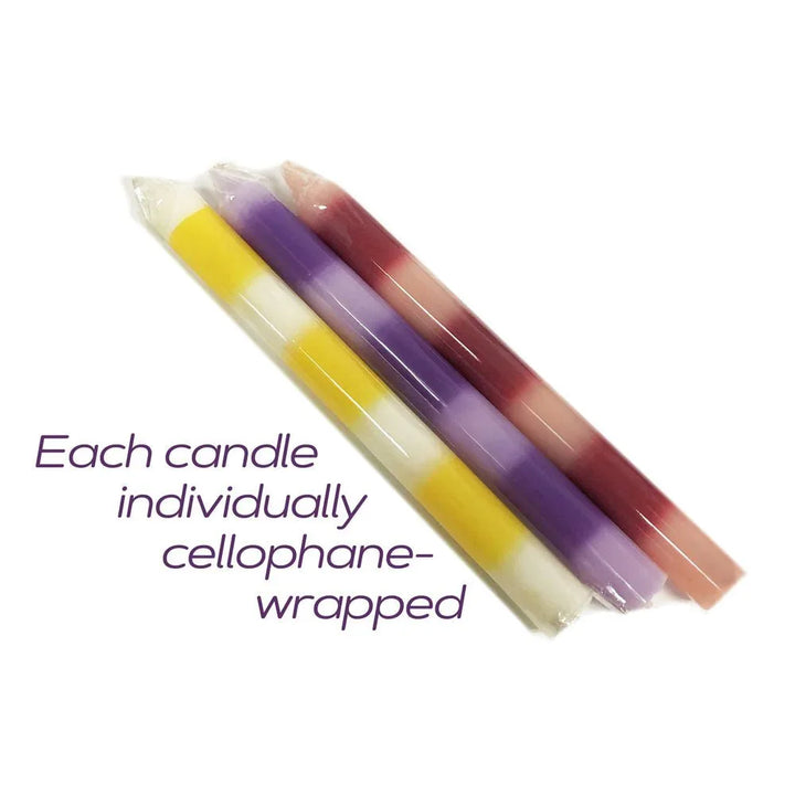 The three Pastellines candles lying cellophane-wrapped, captioned individually wrapped