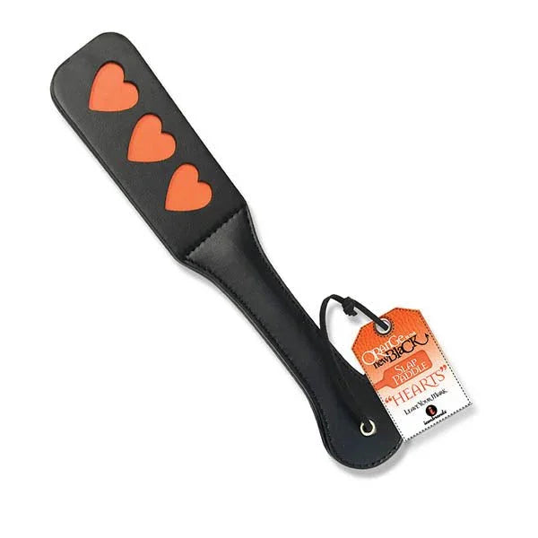 Orange Is The New Black Slap paddle in Black with three orange hearts cut into the face