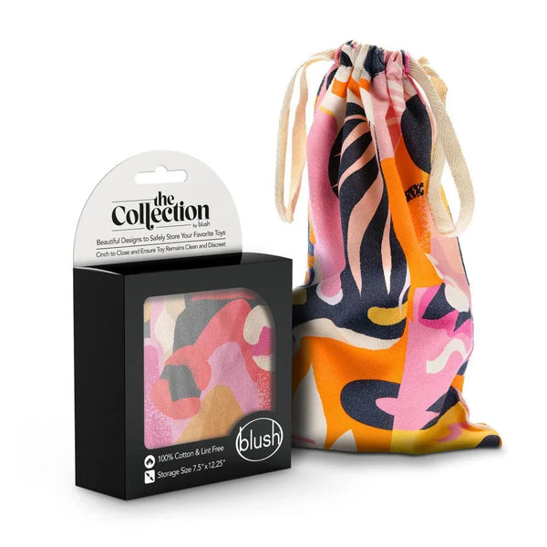 The Collection Burst cotton toy storage bag in orange and pink abstract print, with box