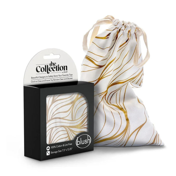The Collection Embrace cotton toy storage bag in white with gold line print, with box