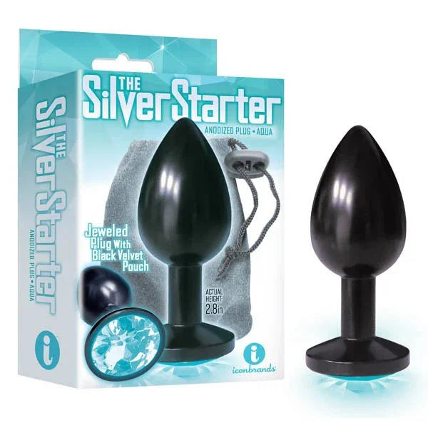 The Silver Starter black anodised plug with an aqua jewel base, beside its retail box