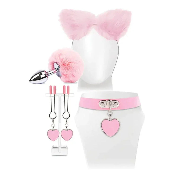 The Kitty Kit laid out: pink cat ears, tail plug, nipple clamps and a heart collar