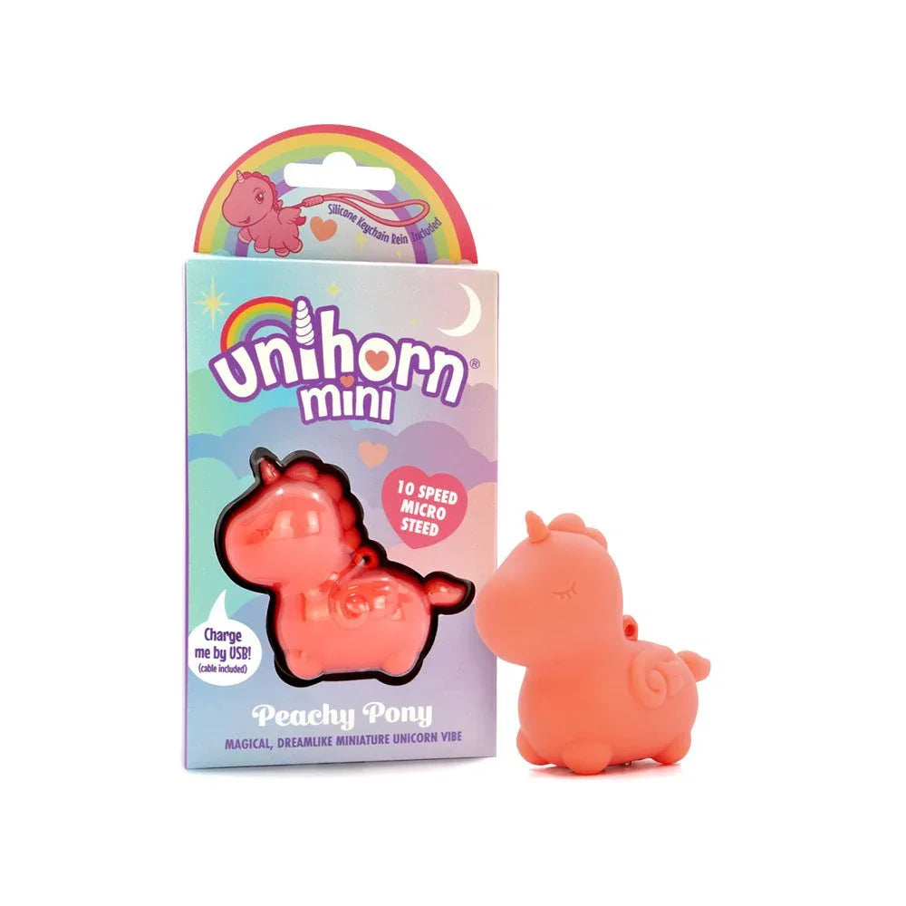 Unihorn Mini Peachy Pony stimulator in Peach, beside its rainbow box
