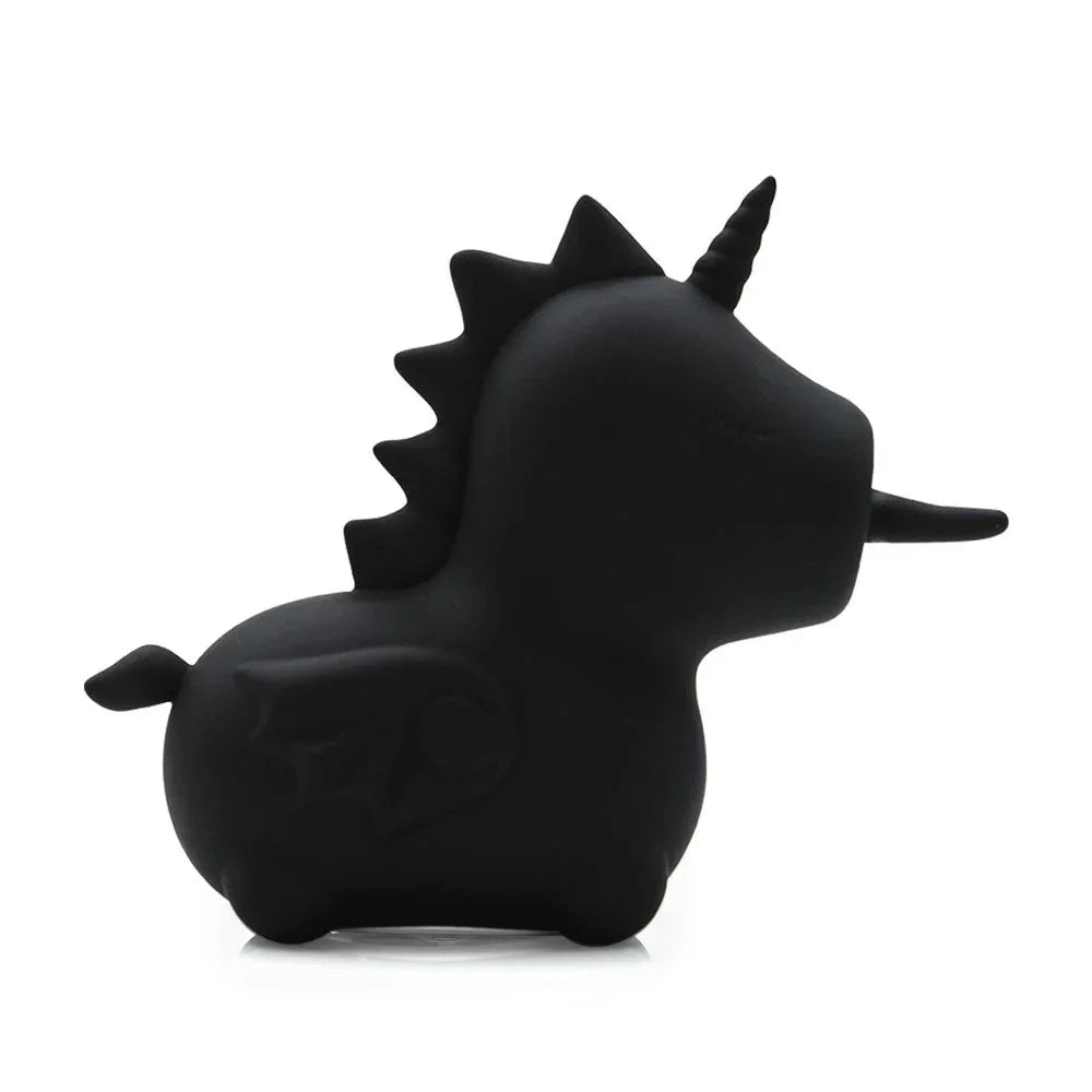 Wild Spirit unicorn facing right, spiked mane and tail in profile