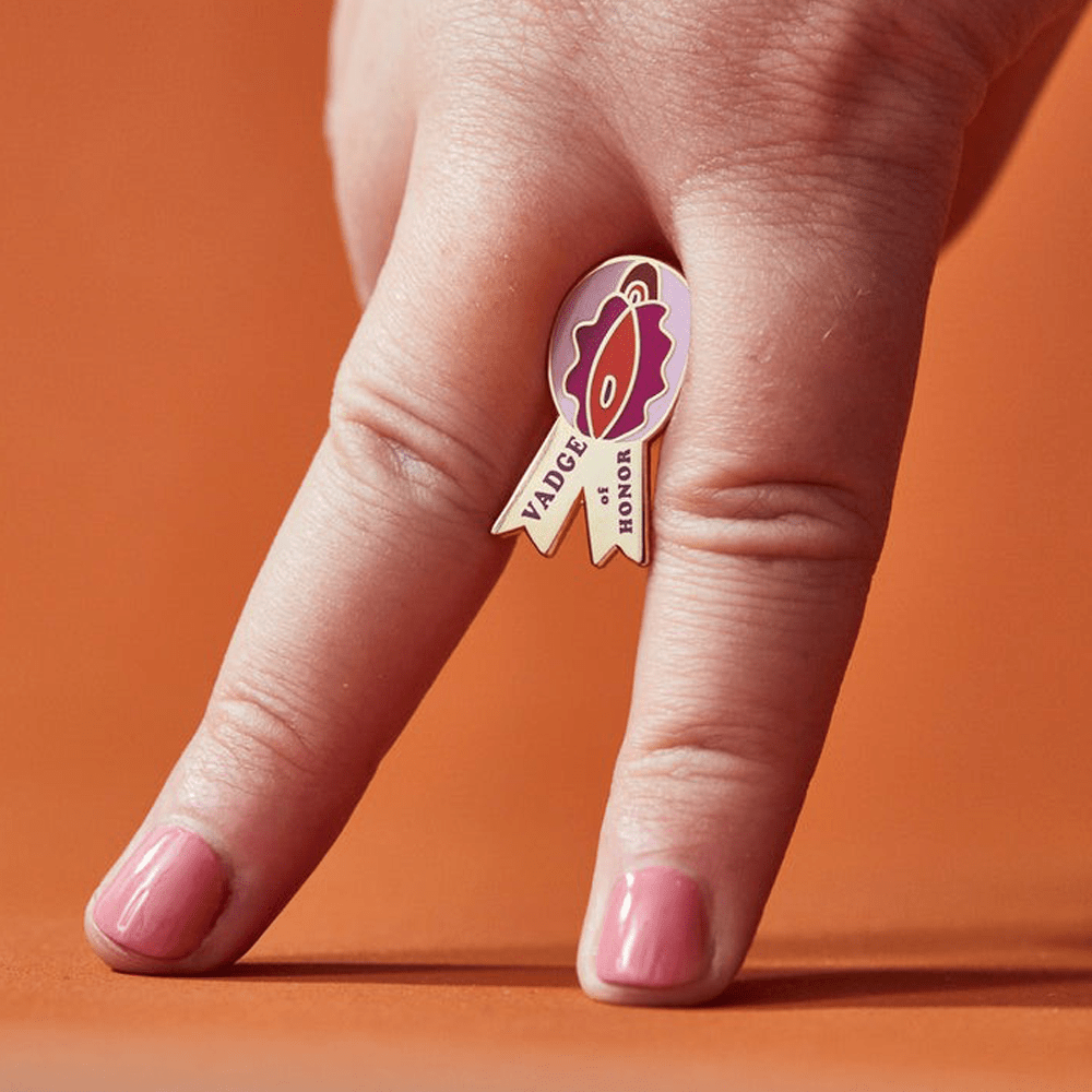 Buy Vadge Of Honor Enamel Pin – Naughtyhut NZ sex toys online. Discreet delivery & top brands.